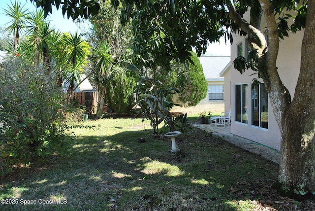 view of yard with a patio area and fence