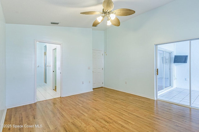 unfurnished bedroom with light wood-style flooring, visible vents, and baseboards