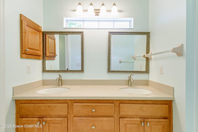 full bath with a sink and double vanity