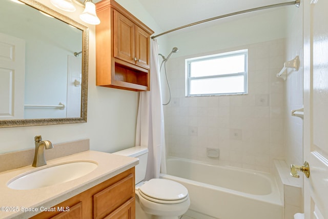 bathroom featuring shower / tub combo with curtain, vanity, and toilet