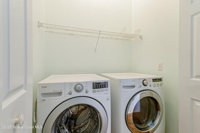 clothes washing area with independent washer and dryer