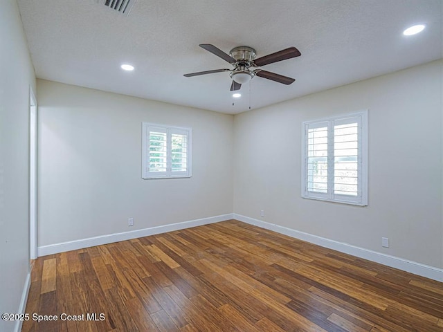 8075 134th St, Sebastian, FL 32958 - empty room featuring ceiling fan, a textured ceiling, and dark hardwood / wood-style flooring
