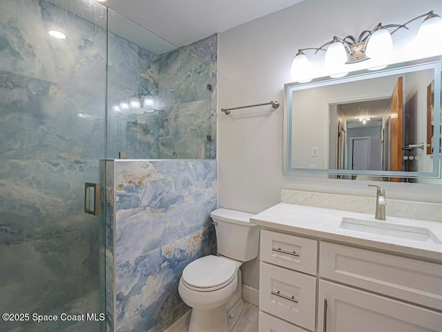 8075 134th St, Sebastian, FL 32958 - bathroom with vanity, an enclosed shower, and toilet