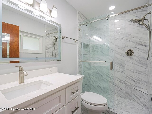8075 134th St, Sebastian, FL 32958 - bathroom with vanity, an enclosed shower, and toilet