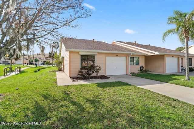 ranch-style home with a garage and a front yard