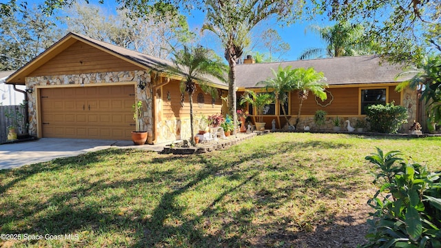 single story home with a garage and a front lawn