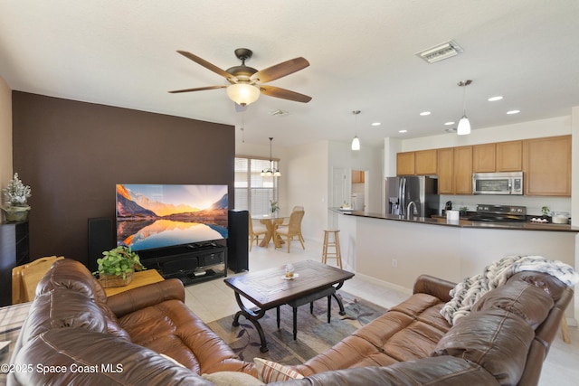 living area with light tile patterned floors, visible vents, baseboards, ceiling fan, and recessed lighting