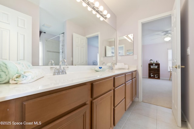 bathroom with ceiling fan, curtained shower, tile patterned flooring, a sink, and double vanity