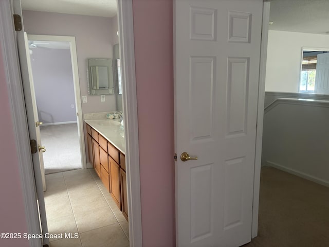 bathroom with tile patterned flooring and vanity