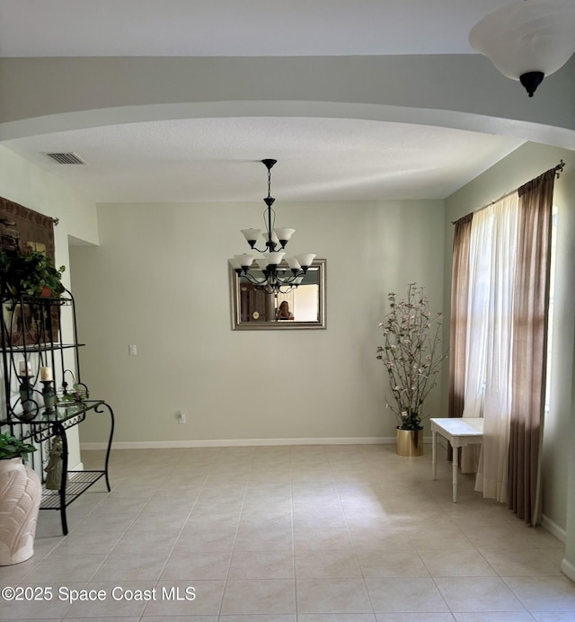 113 Wading Bird Cir SW, Palm Bay, FL 32908 - dining area featuring a chandelier, light tile patterned floors, and baseboards