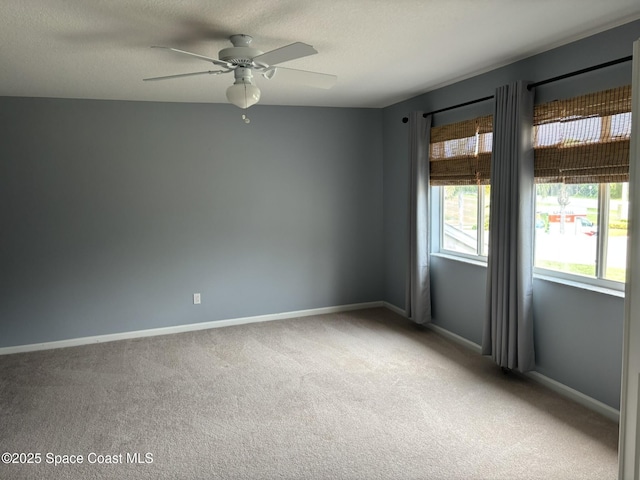 113 Wading Bird Cir SW, Palm Bay, FL 32908 - carpeted spare room featuring ceiling fan, baseboards, and a textured ceiling