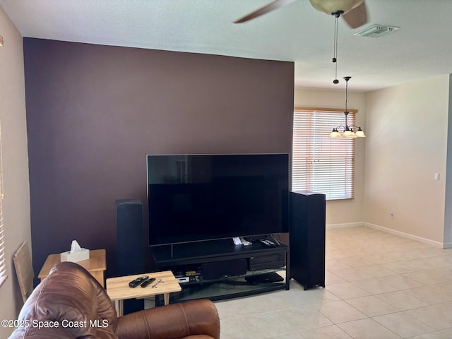113 Wading Bird Cir SW, Palm Bay, FL 32908 - living room featuring a ceiling fan, a chandelier, baseboards, and light tile patterned floors