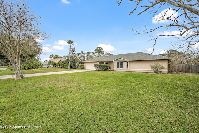 ranch-style house featuring a garage and a front yard