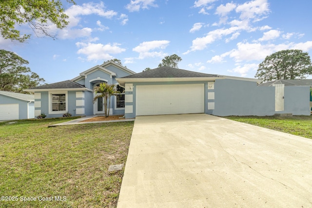 view of front of house featuring a front yard and a garage