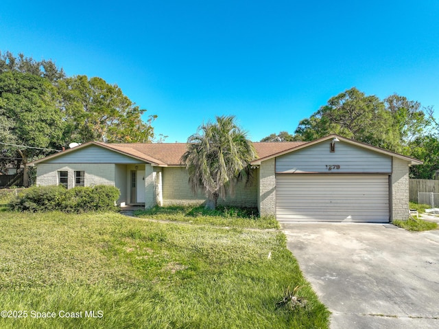 single story home with a garage and a front lawn