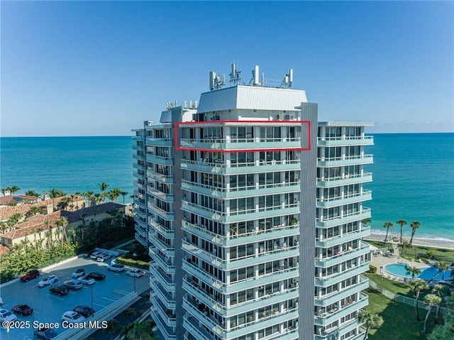 view of building exterior featuring a water view