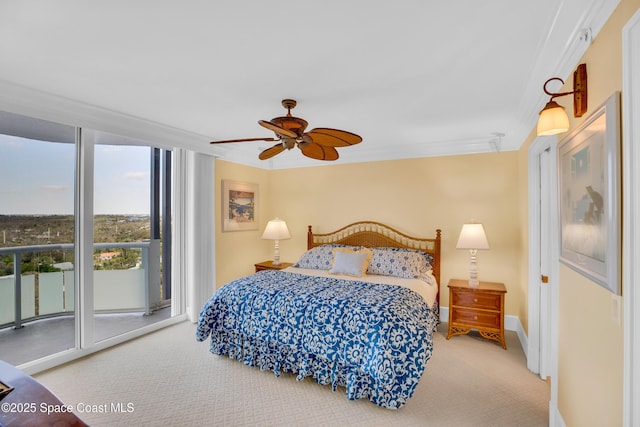 bedroom featuring baseboards, carpet, crown molding, access to outside, and expansive windows