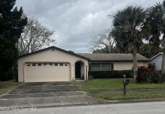 ranch-style house with a front yard, driveway, an attached garage, and stucco siding