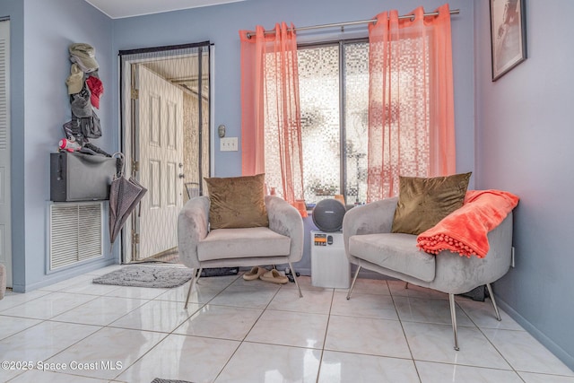 sitting room featuring light tile patterned flooring