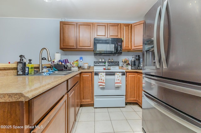 kitchen with sink, white electric range oven, light tile patterned flooring, and stainless steel refrigerator with ice dispenser