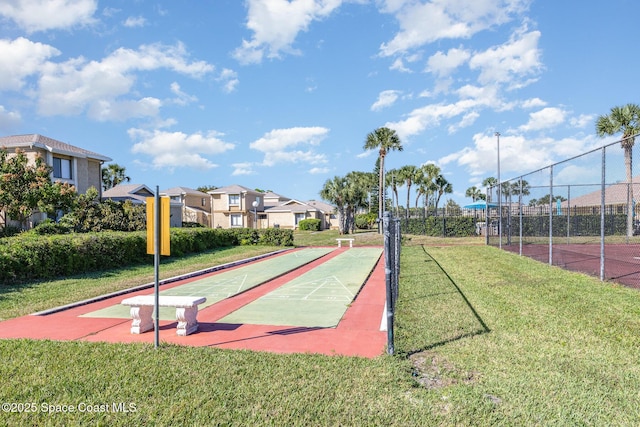 view of home's community with a lawn