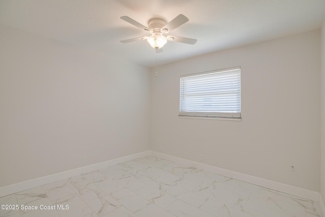 spare room with ceiling fan