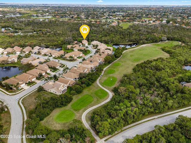 bird's eye view with a water view, a residential view, and golf course view