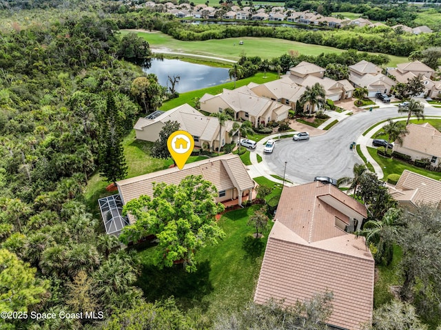 bird's eye view featuring a water view and a residential view