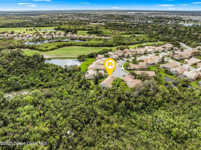 drone / aerial view featuring a water view and a residential view