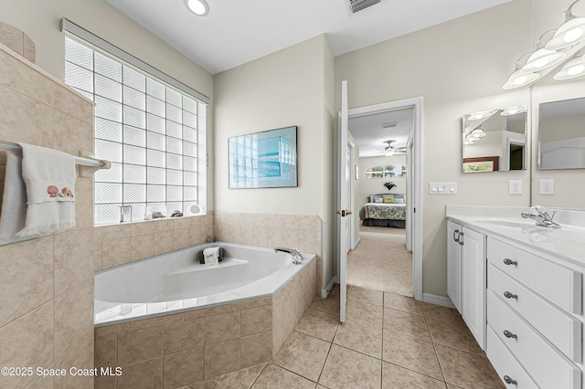 bathroom featuring visible vents, connected bathroom, a garden tub, tile patterned flooring, and vanity