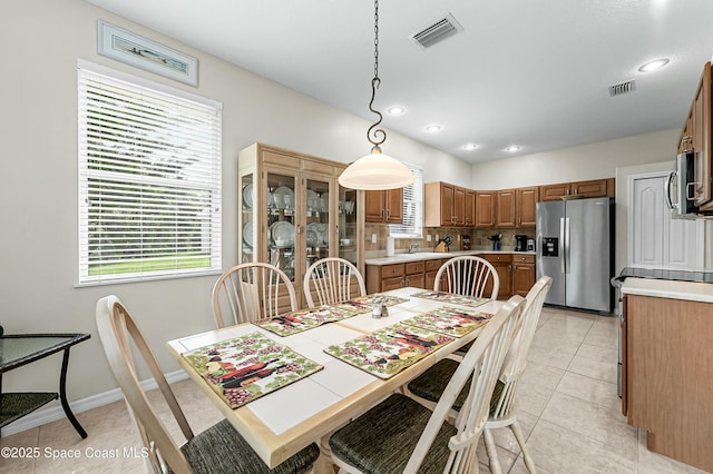 dining room featuring recessed lighting, visible vents, baseboards, and light tile patterned floors