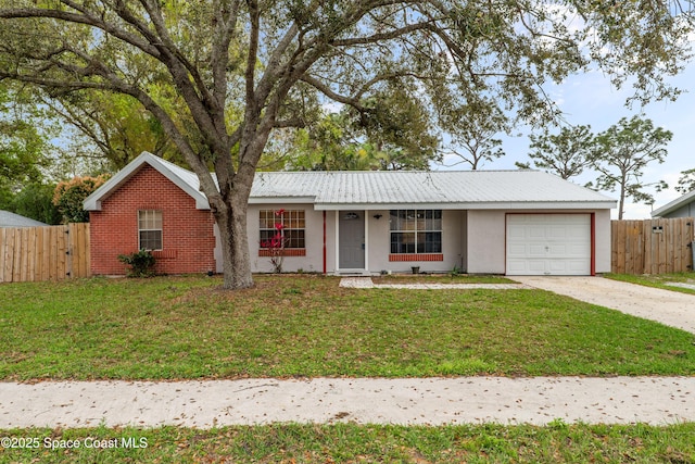 ranch-style home featuring an attached garage, driveway, fence, and a front lawn