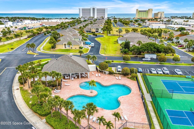 birds eye view of property with a water view