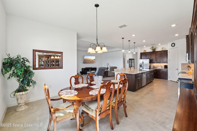 dining area featuring baseboards, visible vents, a notable chandelier, and recessed lighting