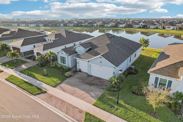 bird's eye view featuring a residential view and a water view