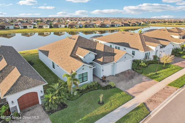 aerial view featuring a water view and a residential view