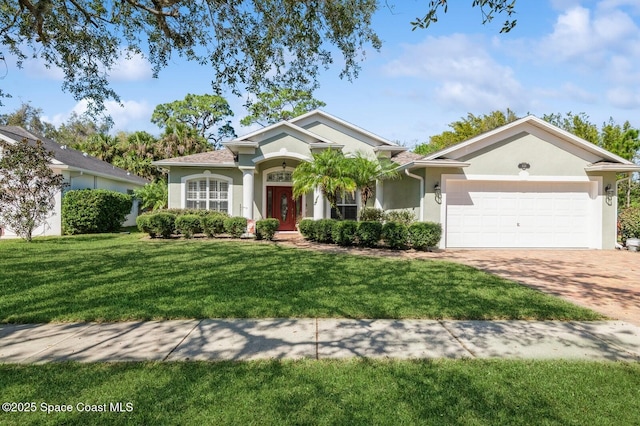 view of front of house featuring a front yard and a garage