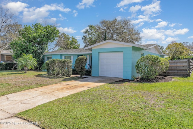 single story home with a garage and a front lawn