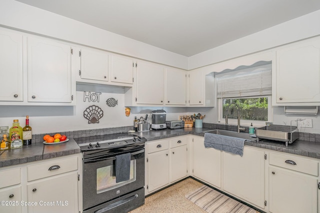 kitchen featuring white cabinetry, sink, and black range with electric cooktop