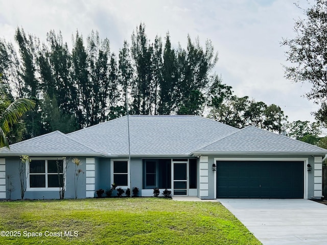 ranch-style home with a garage and a front yard