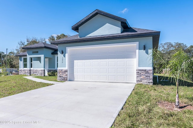 view of front of home featuring an attached garage, stone siding, a front yard, and stucco siding