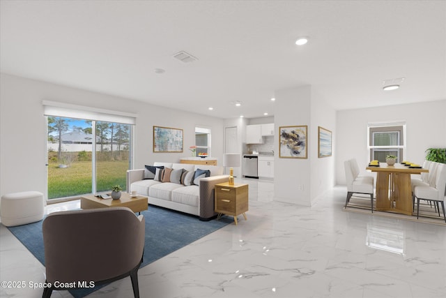 living room with marble finish floor, visible vents, and recessed lighting