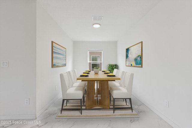 dining area featuring marble finish floor, visible vents, and baseboards