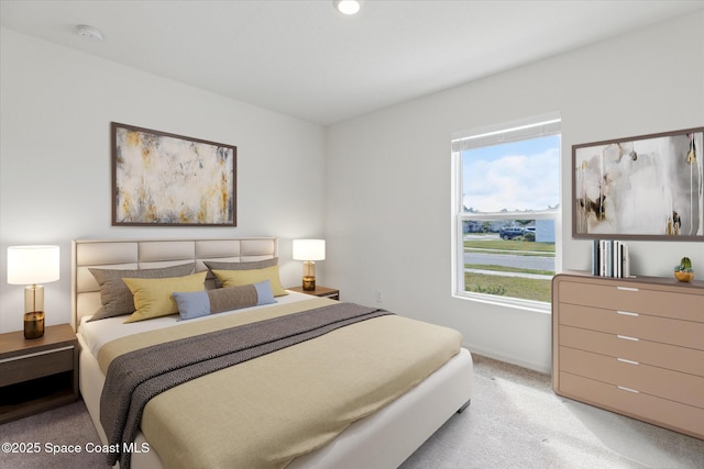 bedroom with light colored carpet