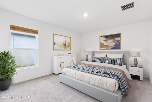 carpeted bedroom with visible vents