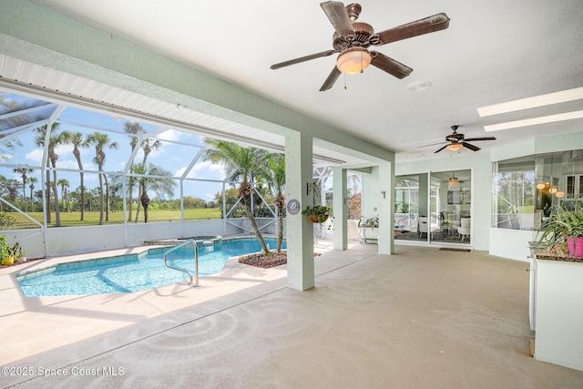 outdoor pool with a patio, glass enclosure, and a ceiling fan