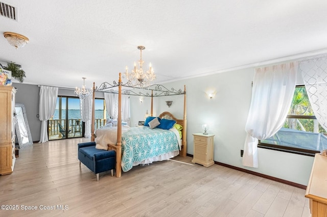 bedroom with access to outside, visible vents, a chandelier, light wood-type flooring, and baseboards