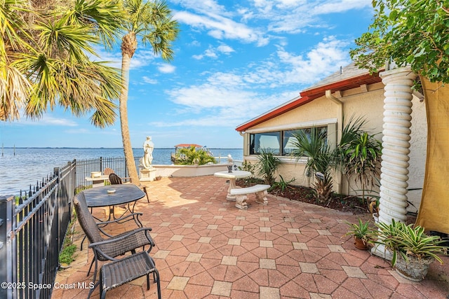 view of patio featuring a water view