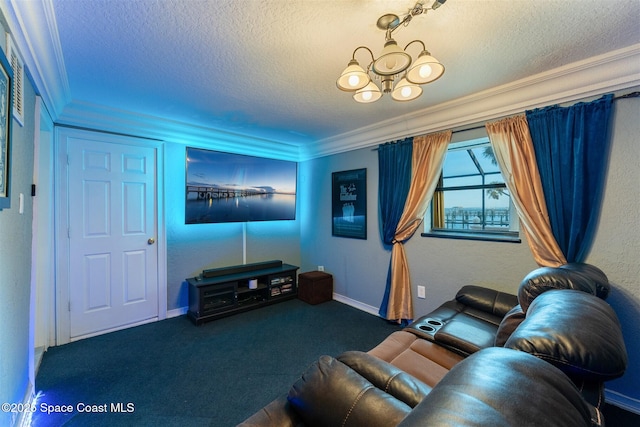 cinema room featuring a chandelier, dark colored carpet, crown molding, and a textured ceiling