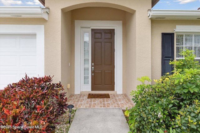 property entrance with a garage